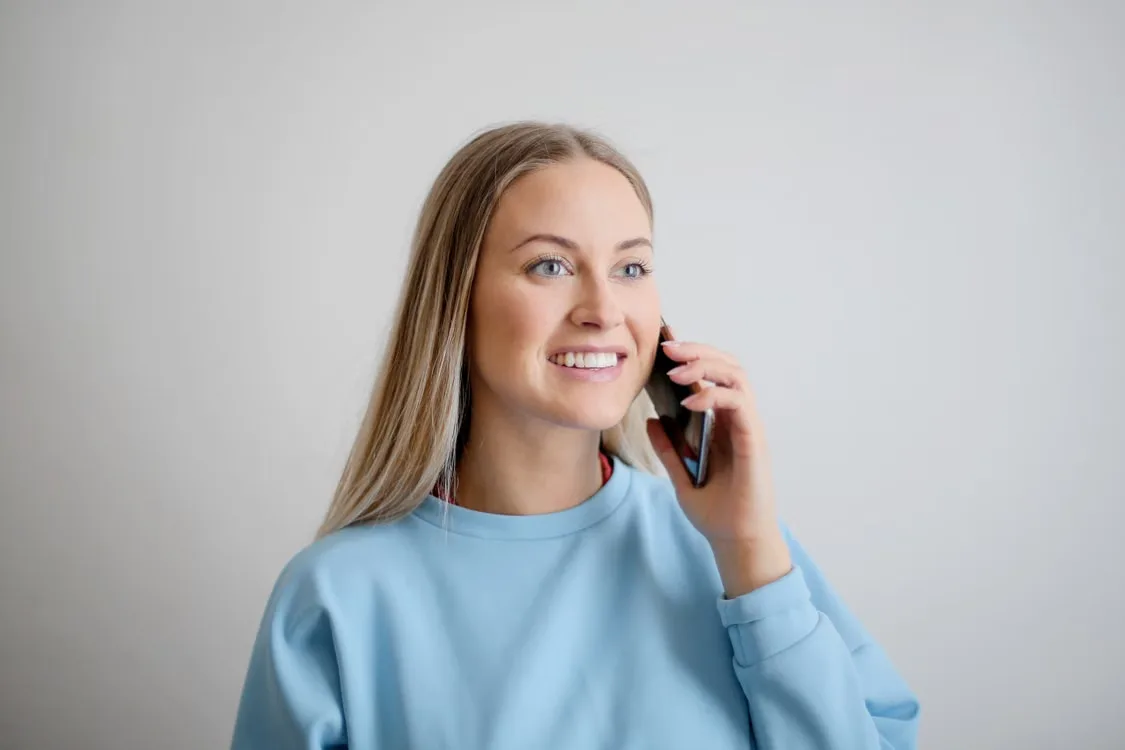 A local property expert talking with a client on the phone
